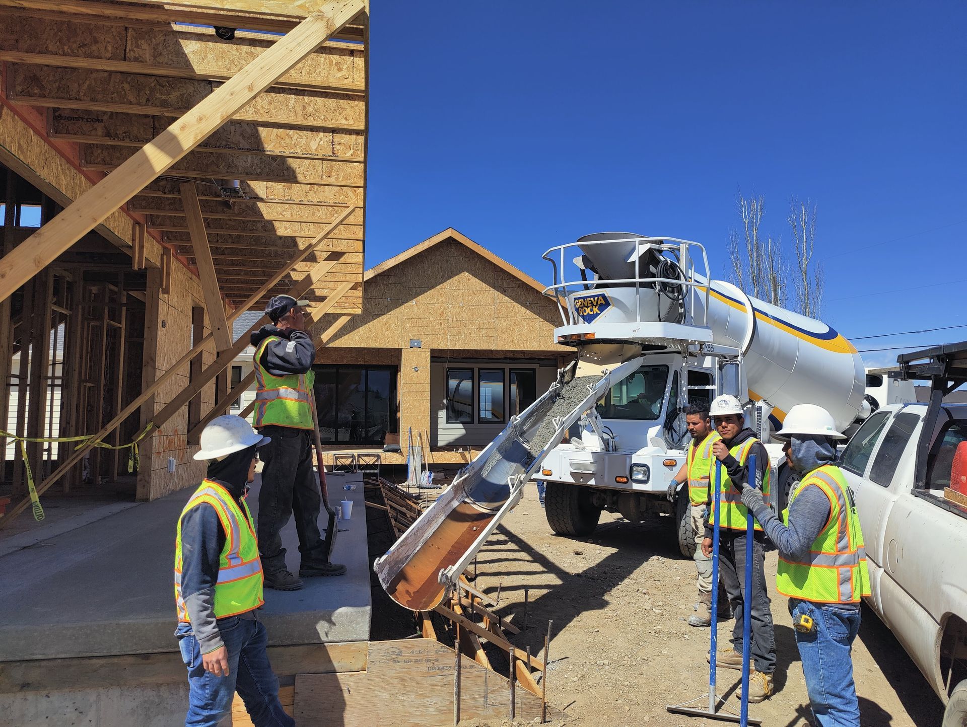 A concrete foundation is being built in a residential area.