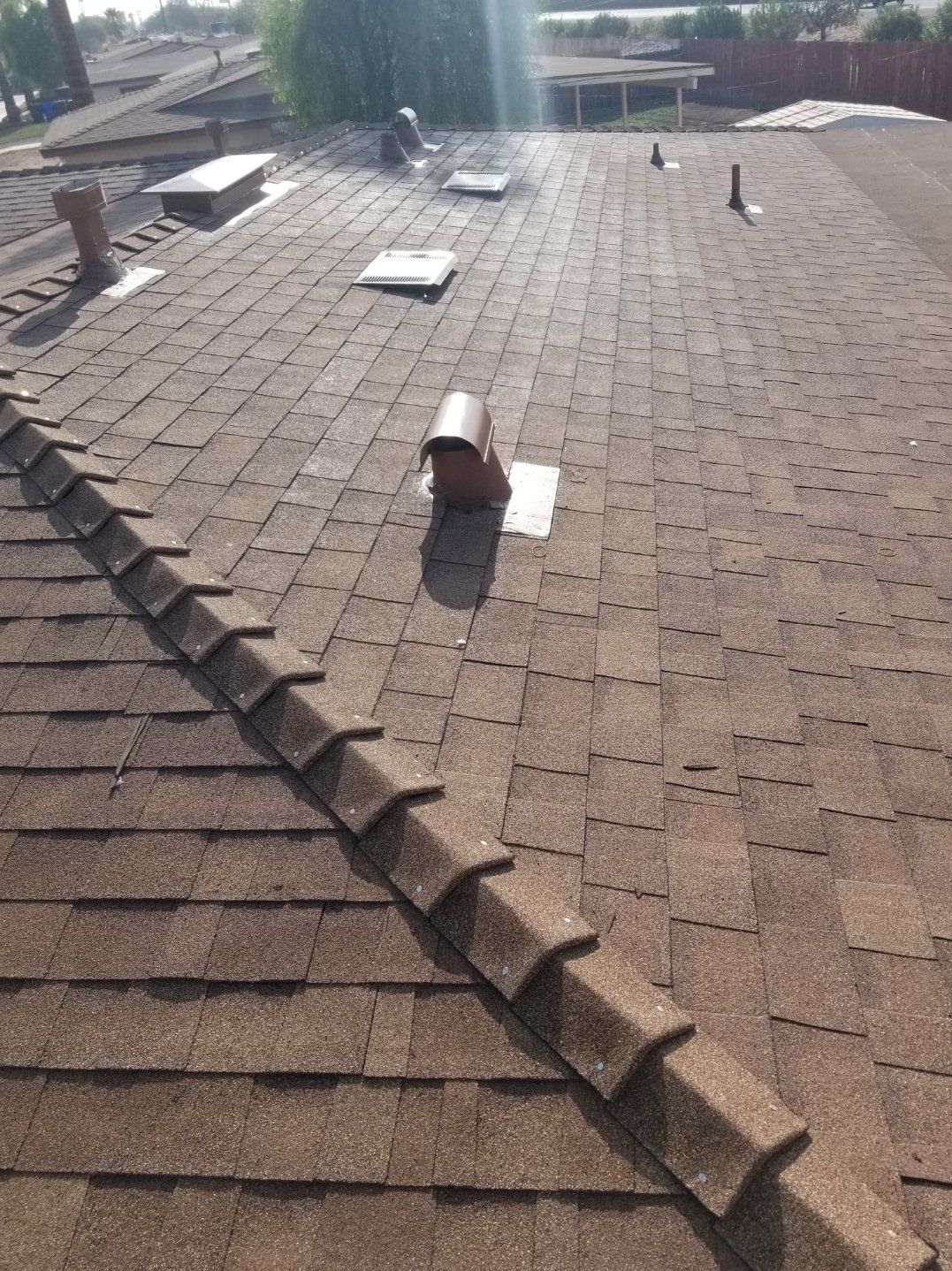 Newly Installed brown shingles roof