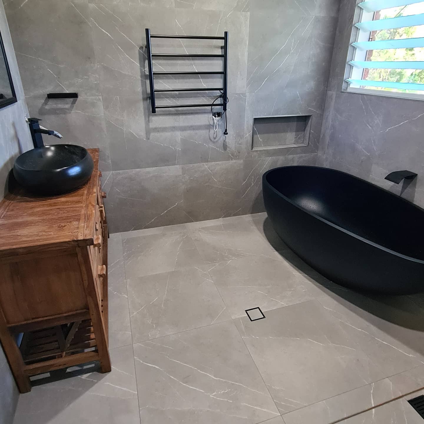 A Black Colored Modern Bathtub —  Bathroom Renovation in Medowie, NSW