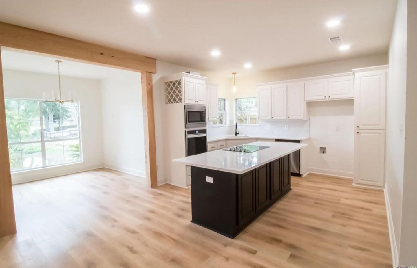 A kitchen with a large island in the middle of the room.