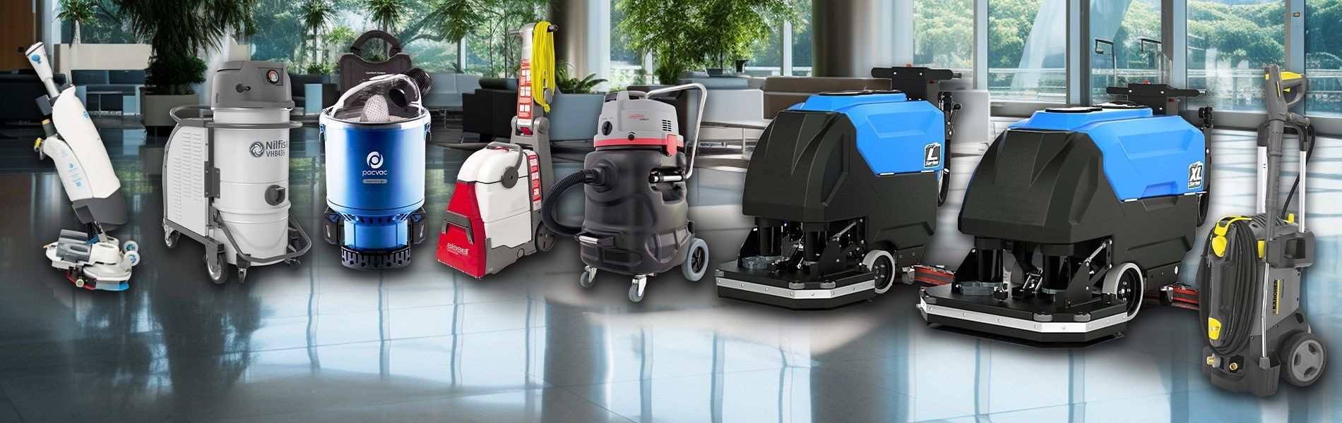 Row of cleaning machines on a reflective floor. Machines are various sizes and colors.