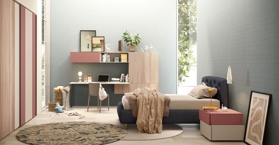 cameretta con elementi rosa e in legno chiaro