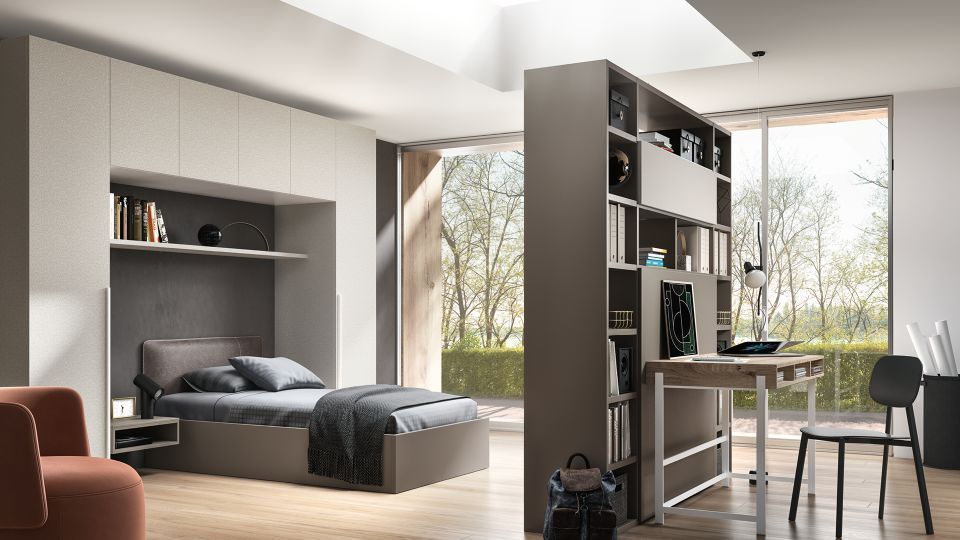 cameretta con libreria che divide due ambienti