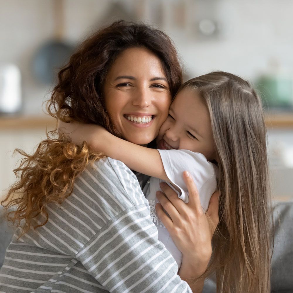 Mother Hugging Her Daughter — Thomasville, GA — Andrew W. Pope Law