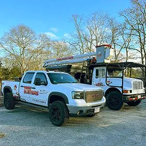 Two trucks are parked next to each other in a parking lot.