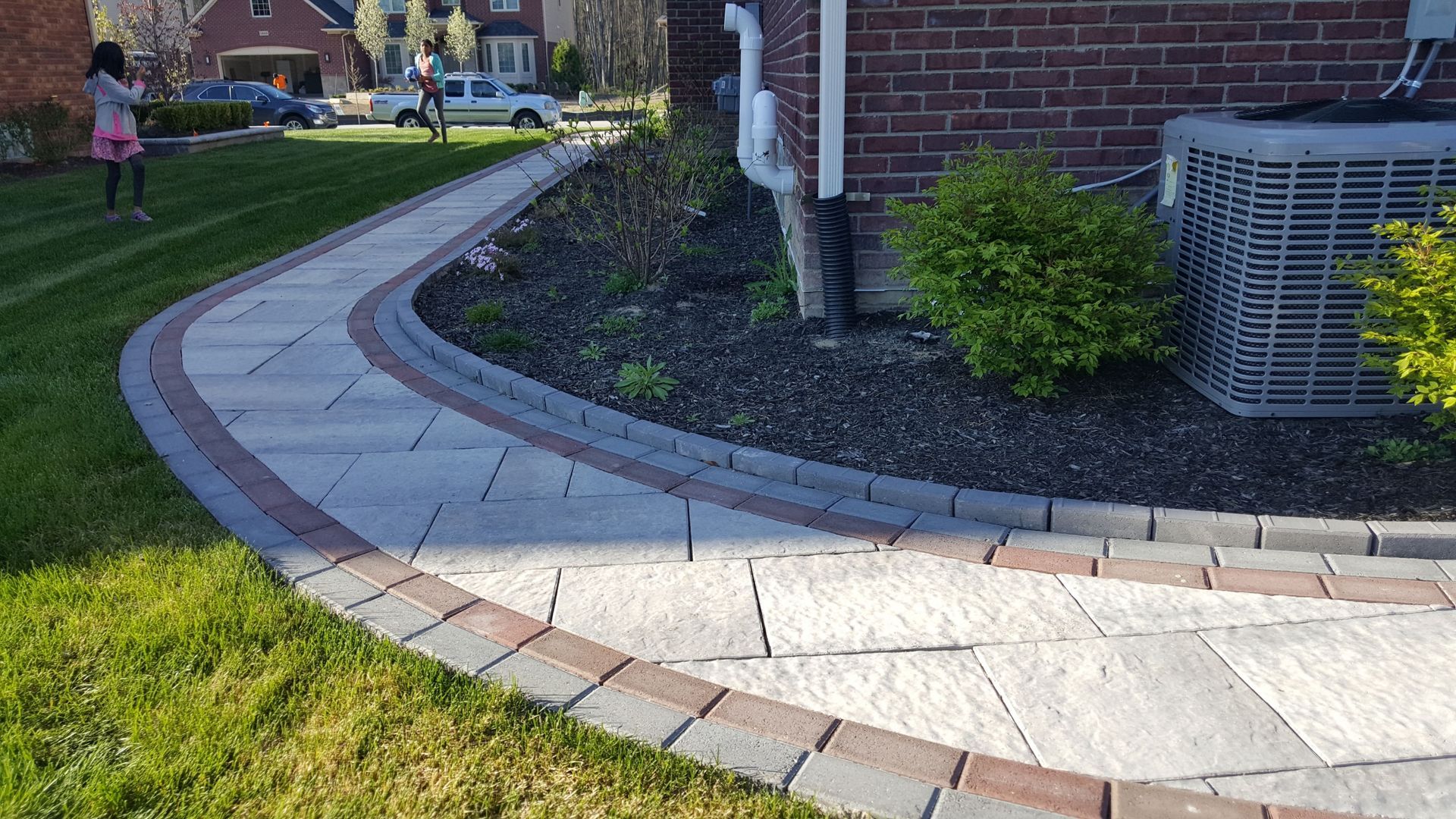 brick walk way with brown and red bricks
