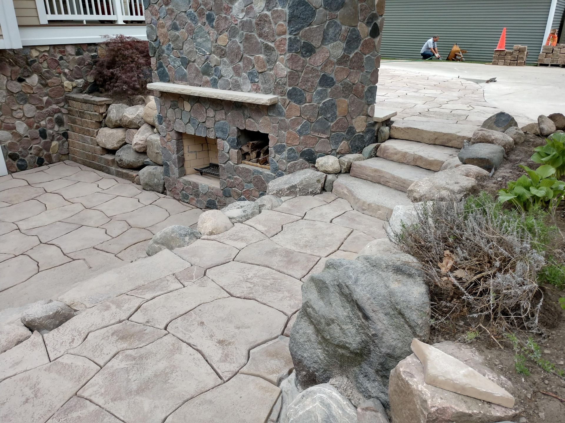 Stone fire place with paver stone landing 