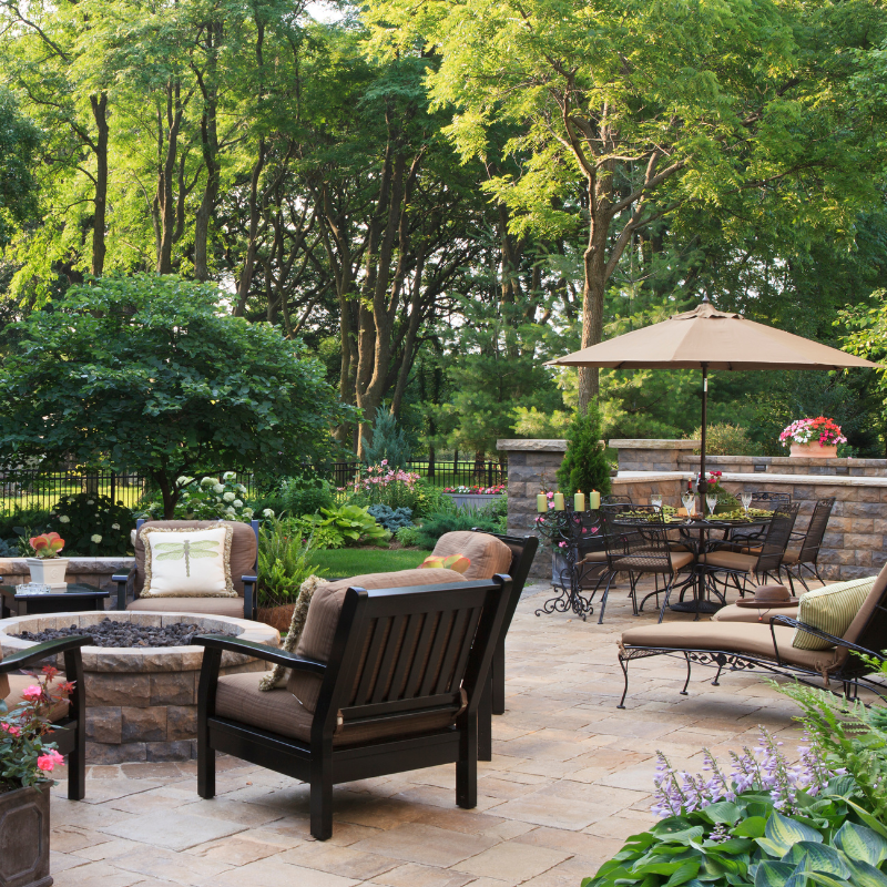 Modern office meeting room with white table, gray chairs, chalkboard wall with notes.