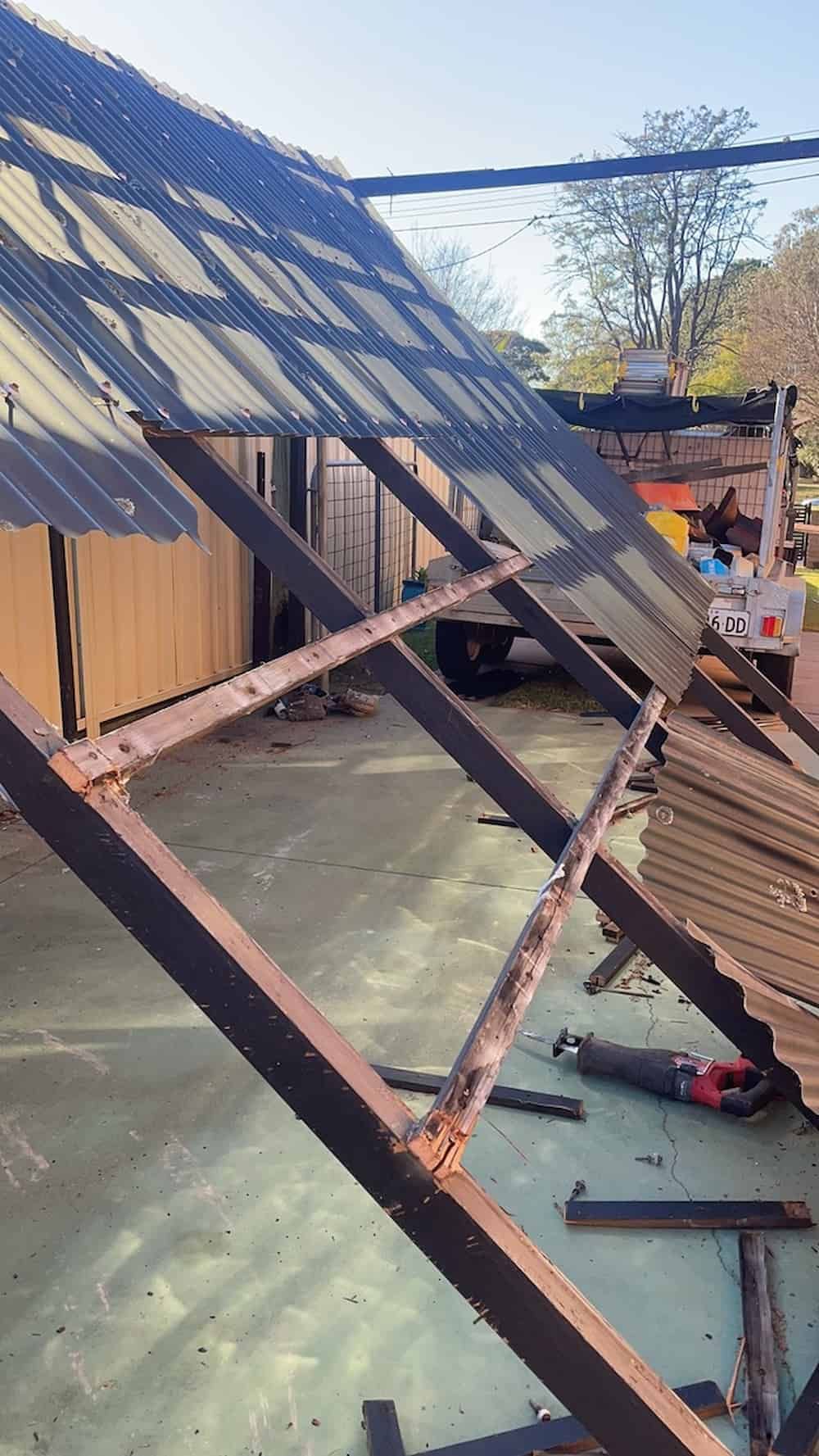 A Metal Structure With A Roof That Has Fallen Off Of It — Gary Eslick Home Improvements In Berkeley Vale, NSW