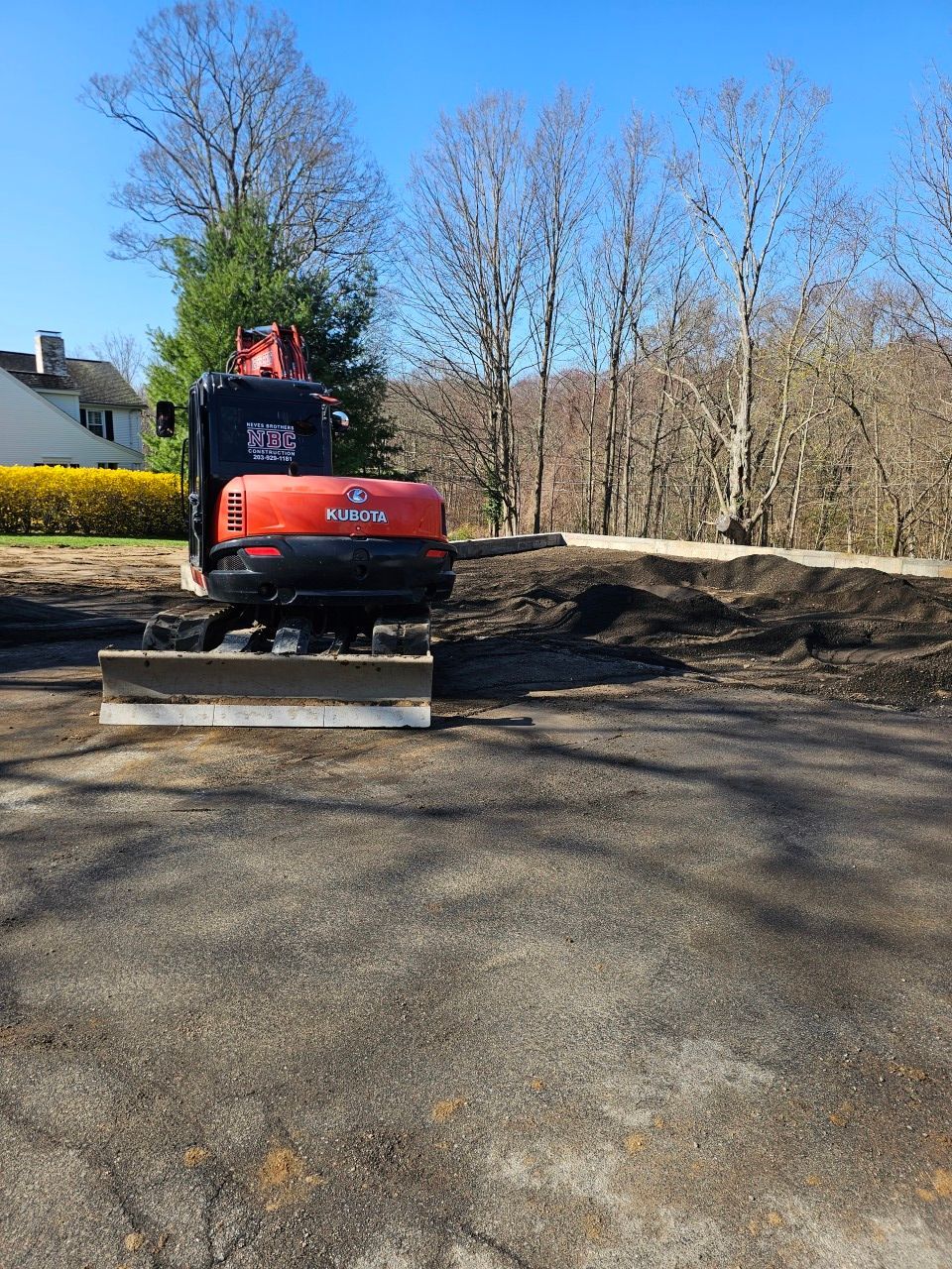 A bulldozer is sitting on top of a dirt field.