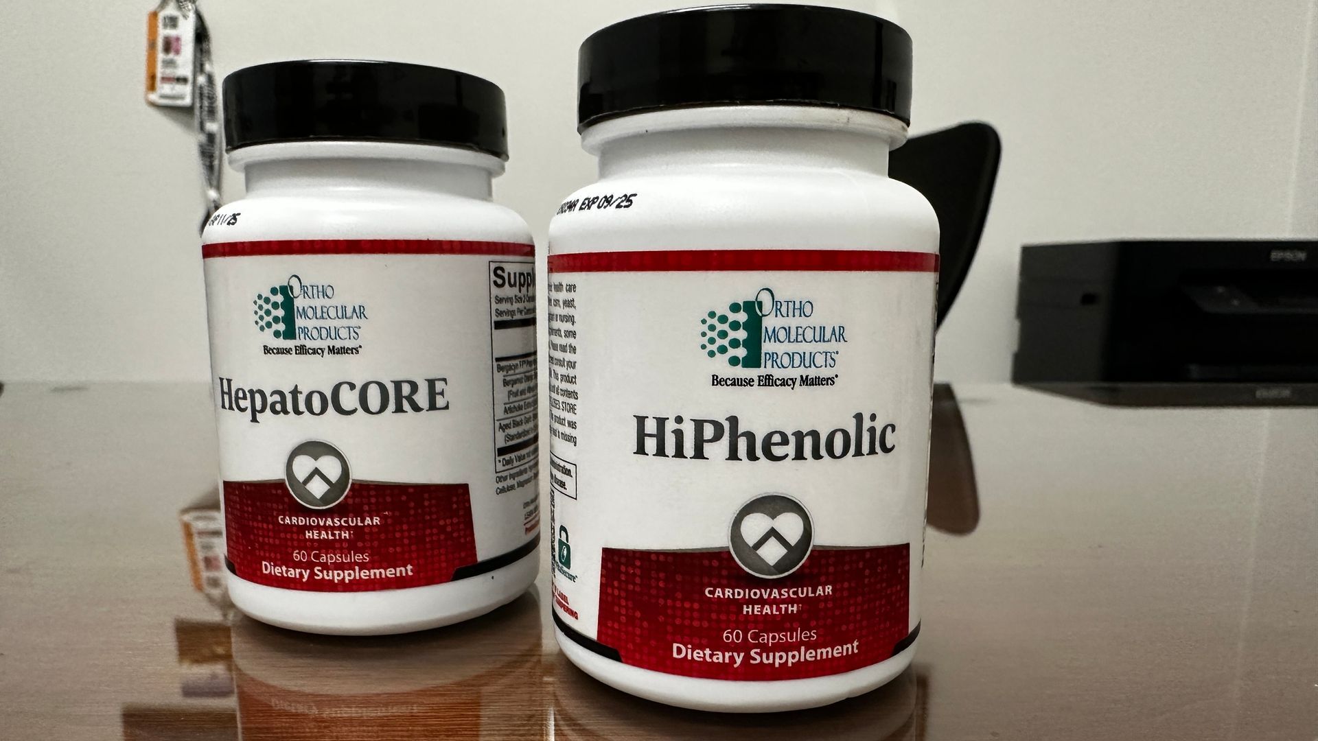 Two bottles of hiphenolic are sitting on a table