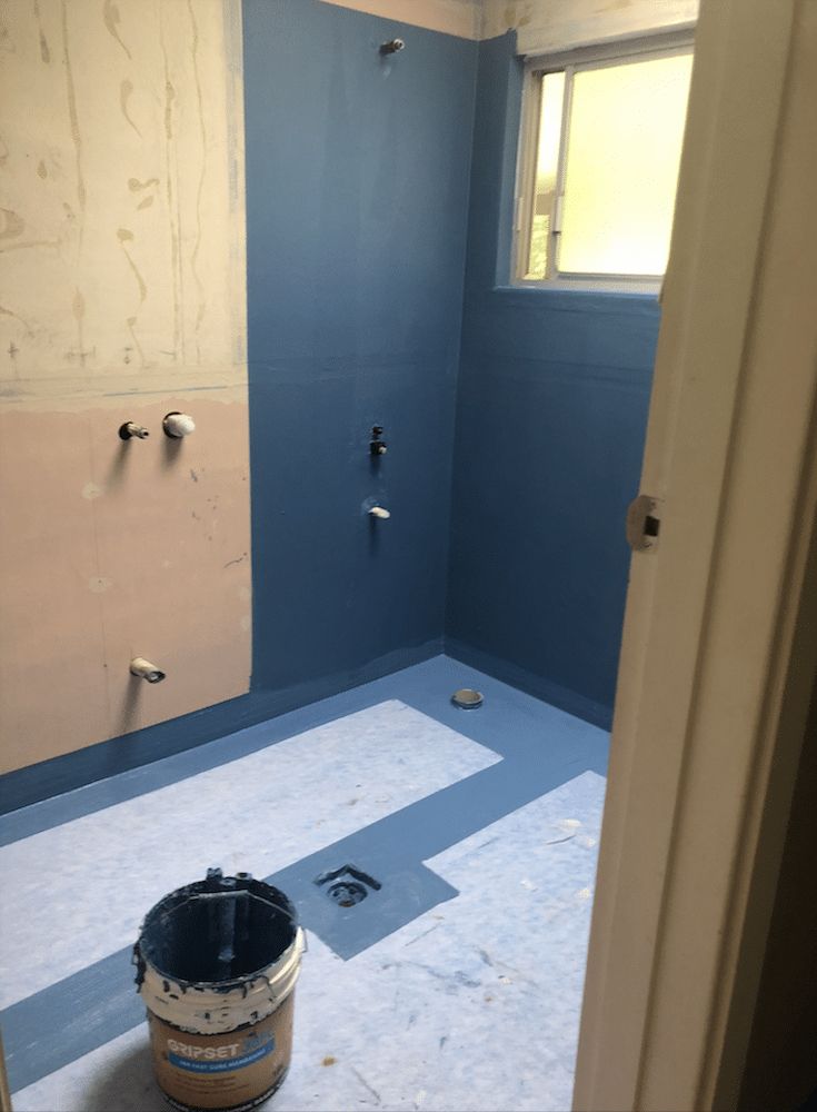 Bathroom With Blue Waterproof Membrane on Walls and Floor — Consider It Sealed Waterproofing in Central Coast, NSW