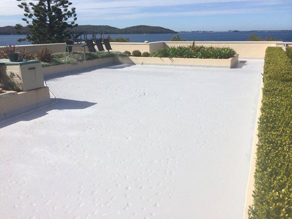 White Coated Rooftop With Built-in Planters and Hedges — Consider it Sealed Waterproofing in Crangan Bay, NSW