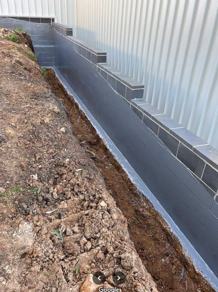 Exterior View of a Foundation, With a Waterproofed Wall — Consider it Sealed Waterproofing in Crangan Bay, NSW