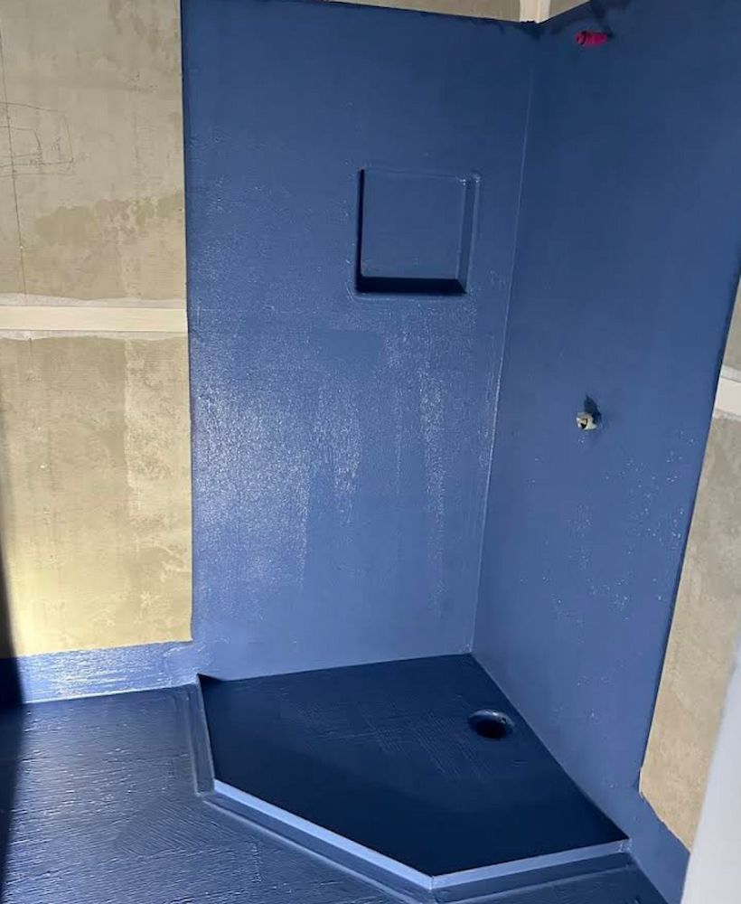 Newly Renovated Shower With Dark Blue Waterproof Walls and Flooring — Consider it Sealed Waterproofing in Crangan Bay, NSW