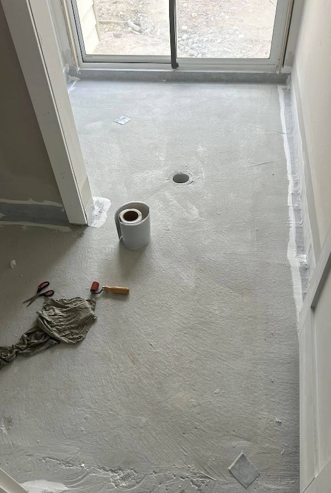 Grey Concrete Floor With Tools — Consider it Sealed Waterproofing in Gosford, NSW