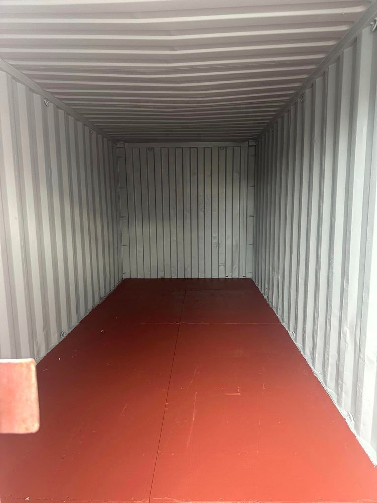 Shipping Container Interior With A Red Floor — Ries Trucking in Gowrie Mountain, QLD