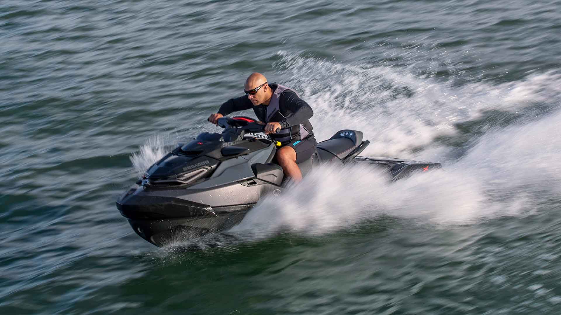 Man riding with a black jet ski