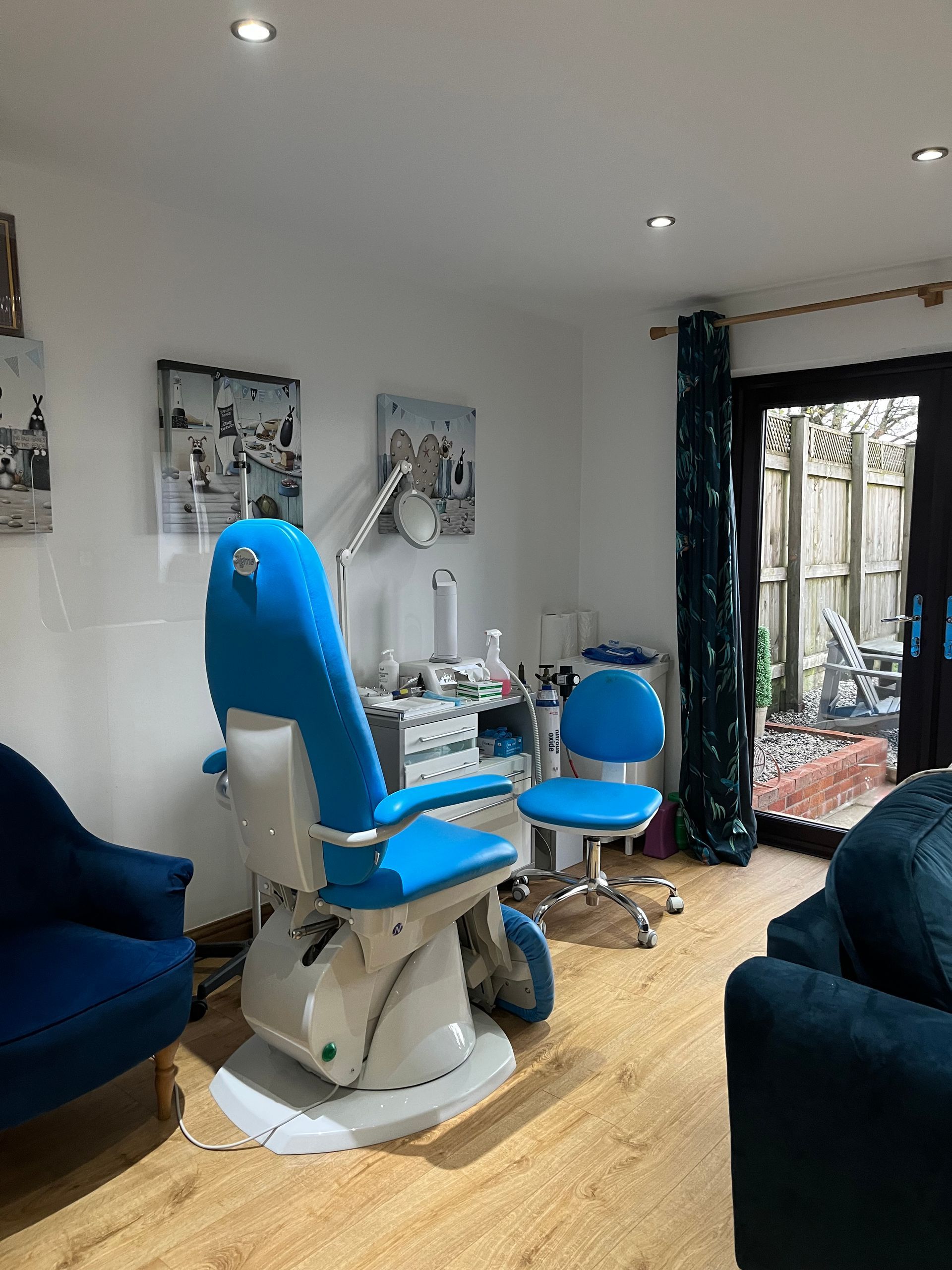 portrait photograph of podiatry treatment room with blue chairs