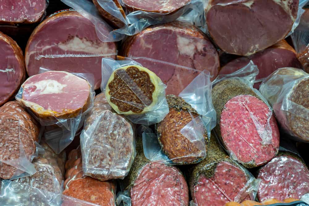 there are many different types of meat wrapped in plastic .