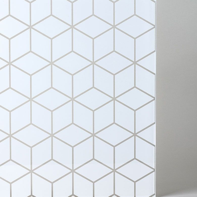 White surface with a geometric cube pattern in gray.