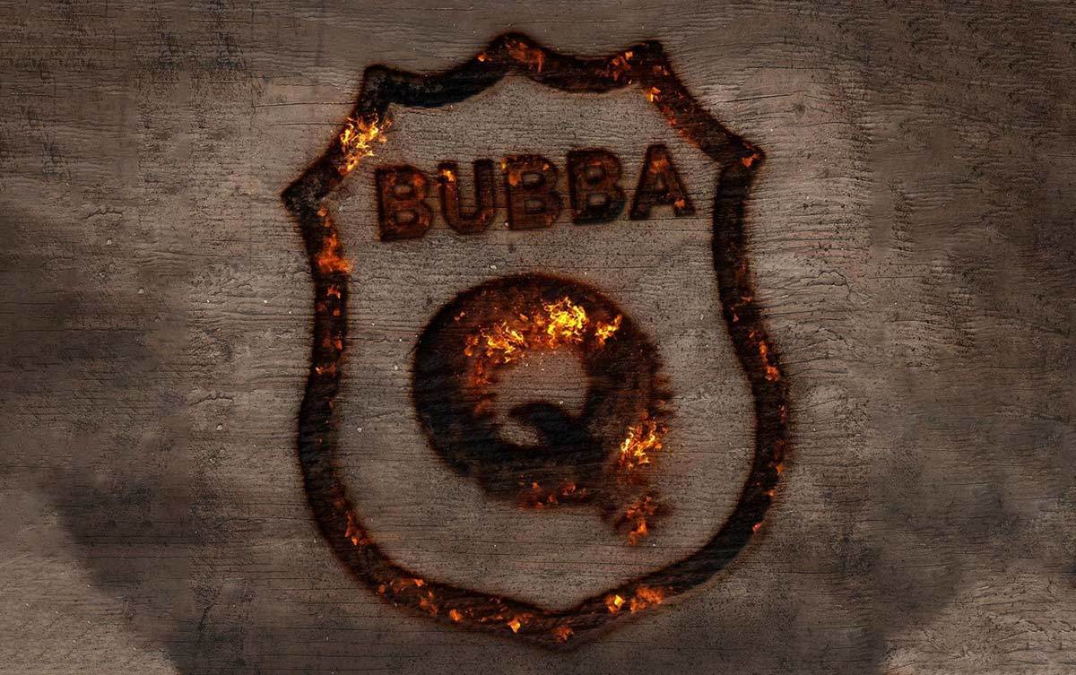 BubbaQs Barbecue logo branded into wood, still smoldering and very hot looking.