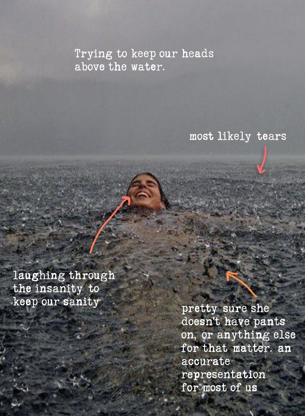 Girl skinny dipping  in deep waters while it is raining, smiling and laughing.