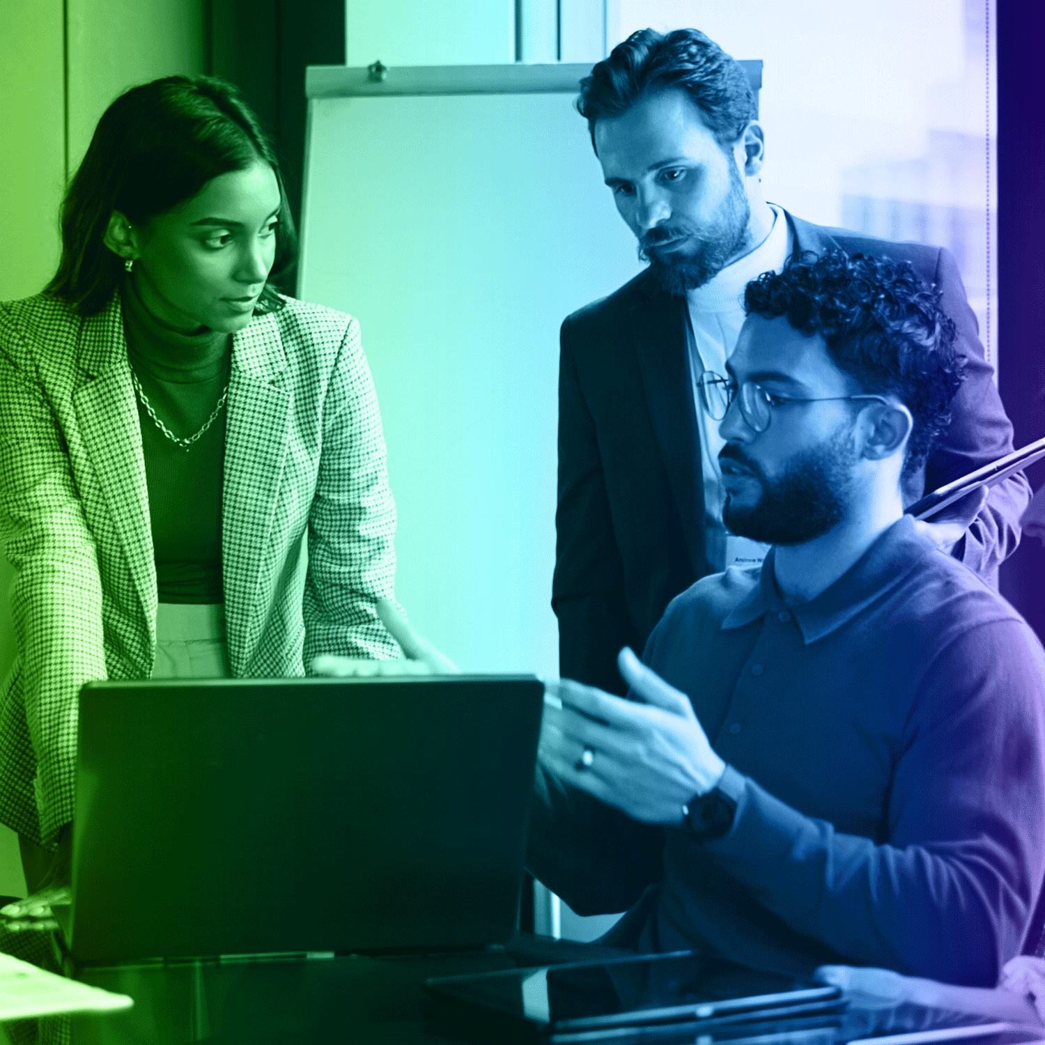 Three people, one using laptop, discussing; whiteboard in background. Green and blue color overlay.