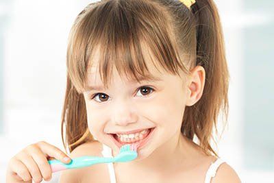 Kid Brushing Her Teeth