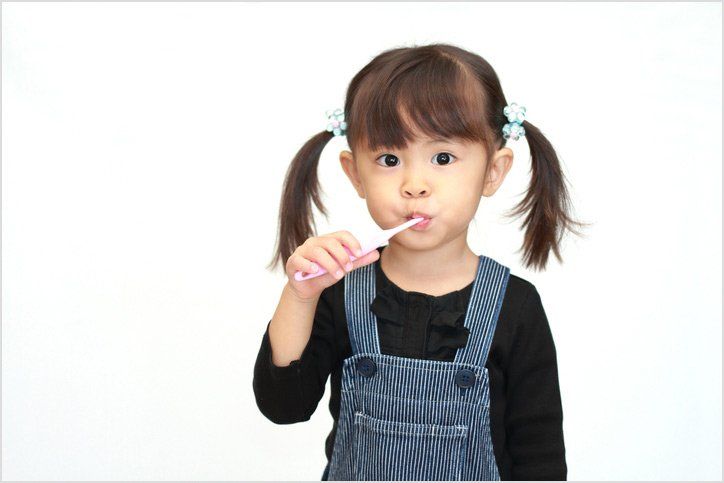 Girl Brushing Her Teeth