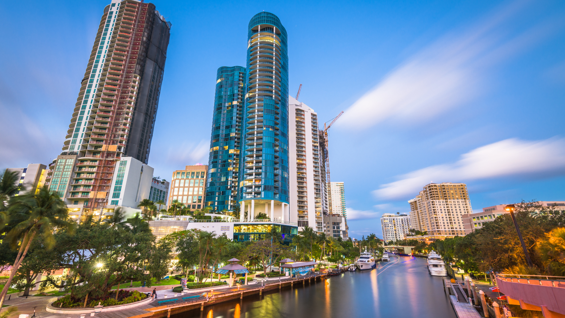 a man is riding a motorcycle down a road .