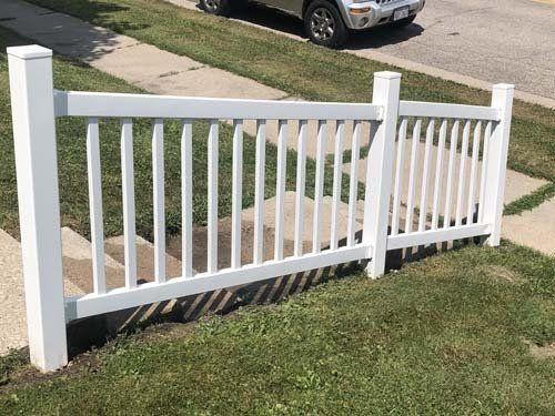 After a power wash and mildew cleaning on white vinyl fence in Wisconsin
