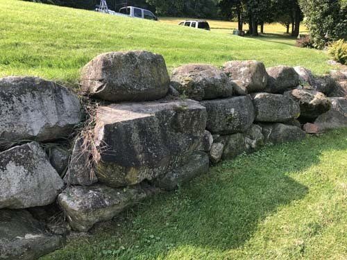 Front angle of Dirty Rocks that require soft and hard power washing