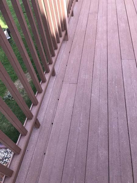 Cleaned and pressure washed red brown deck