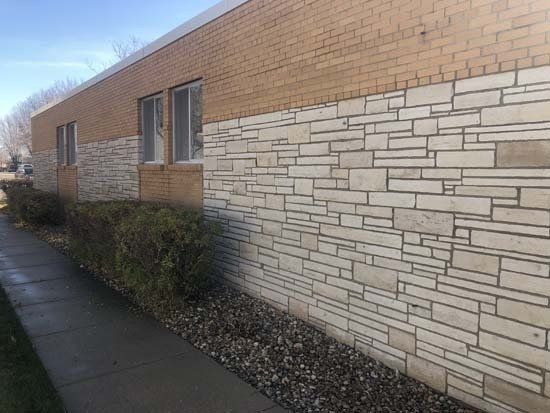 Before and After of Exterior Brick Match of Commercial Pressure Washing