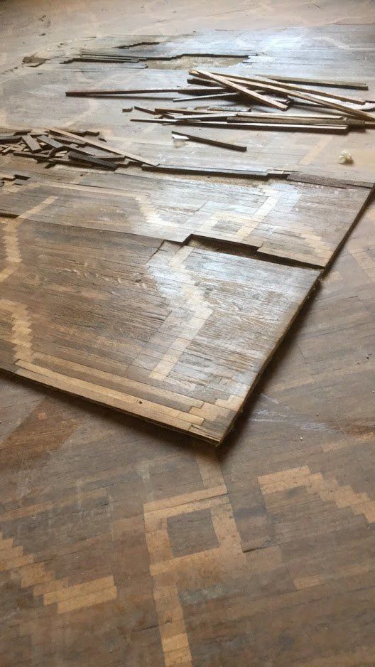 intervento di restauro tappeto di legno