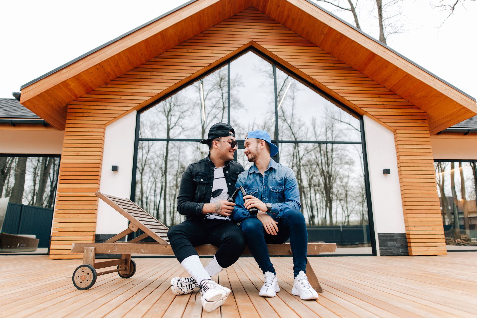 Gay couple in front of house