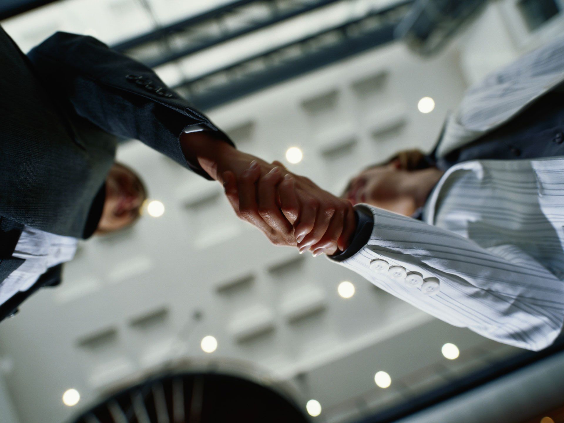 Estate Planning Attorney and Local Client Shaking Hands