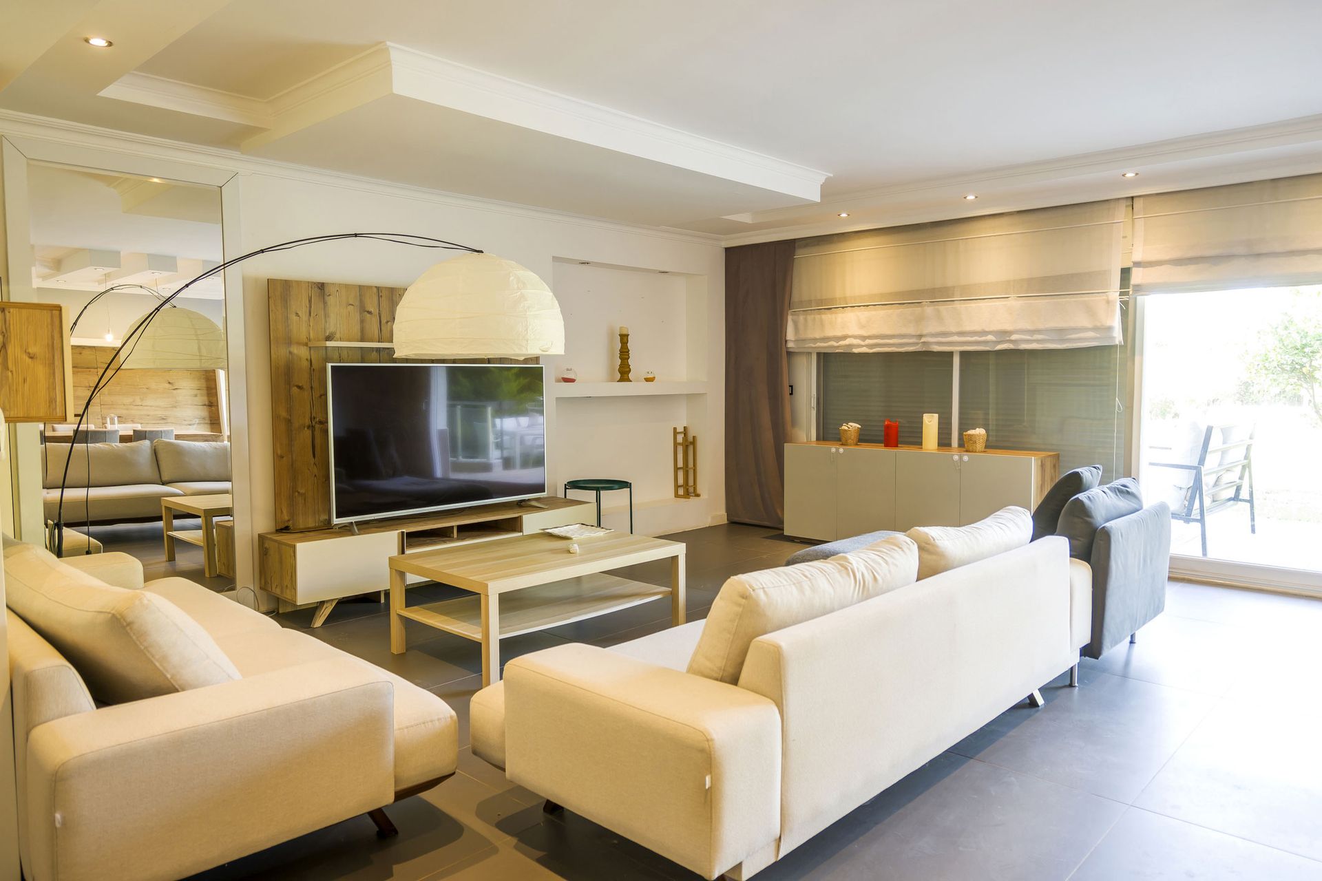 A living room filled with furniture and a flat screen tv.