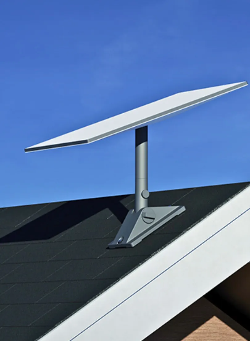 A man is sitting on the roof fixing a satellite dish.