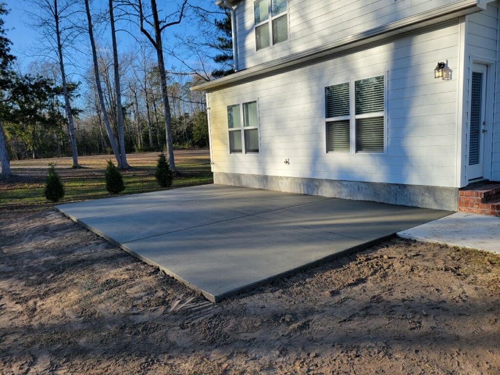 Concrete service crew pouring and finishing new slab.