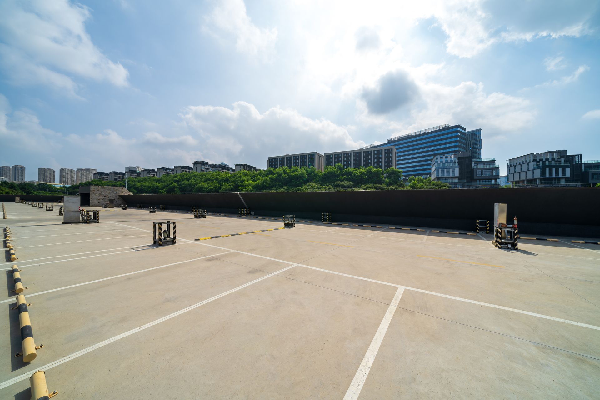 Angled image of a concrete sidewalk, with a building in the background
