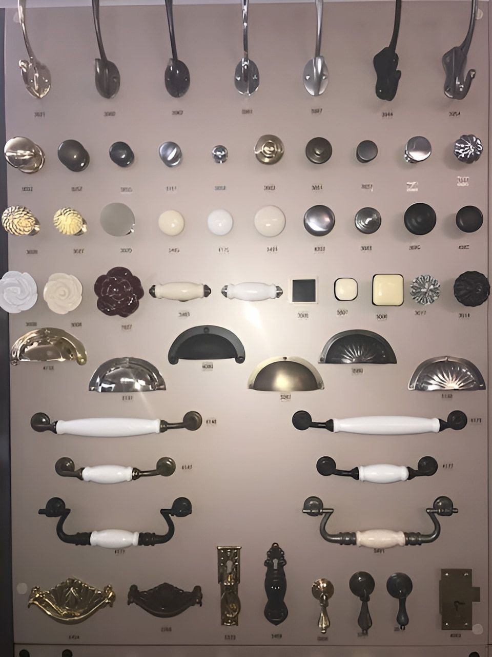 A Close Up Of A Sliding Barn Door Hardware On A White Door — Wood Cabinet Hardware Distributors In Bungalow, QLD