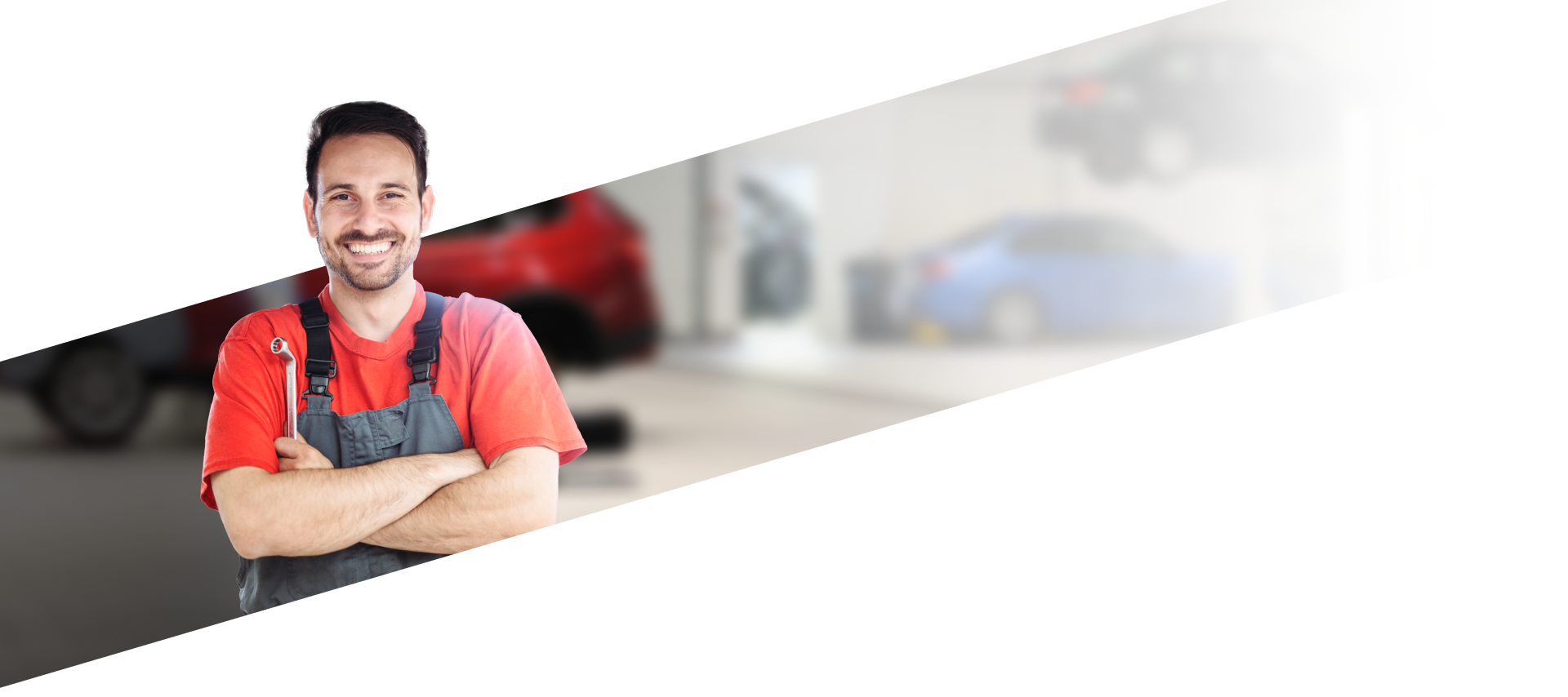 Mechanic in red shirt posing in front of background of garage | RX Automotive