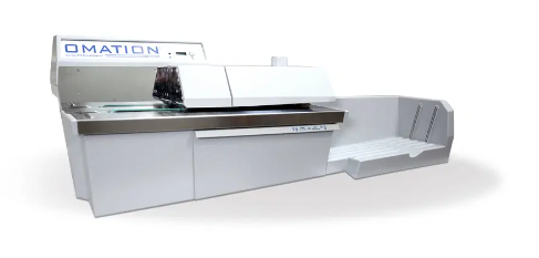 A white machine with the word omation on it