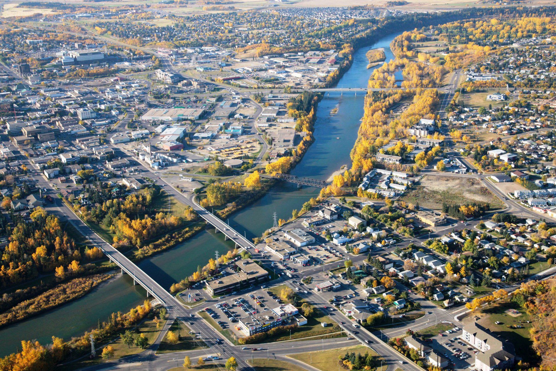 An aerial view of a city with a river running through it