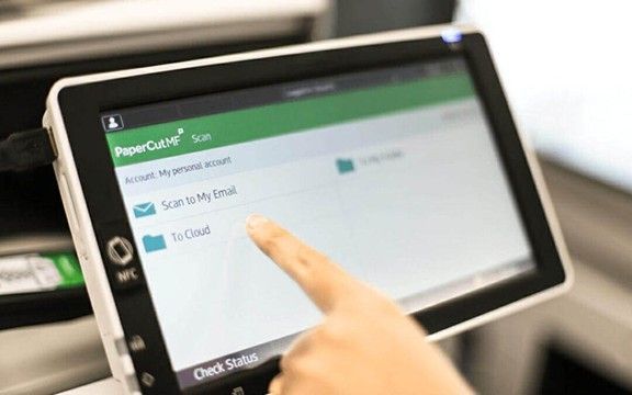 Modern office with multiple printers and copiers optimized for efficiency.