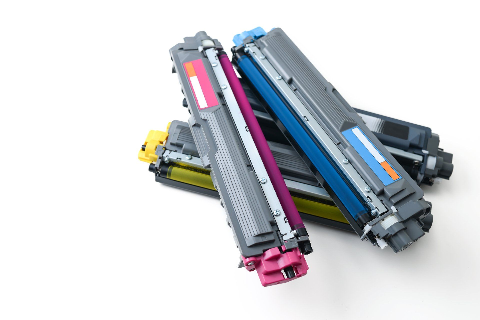 Three different colored printer cartridges are stacked on top of each other on a white background.