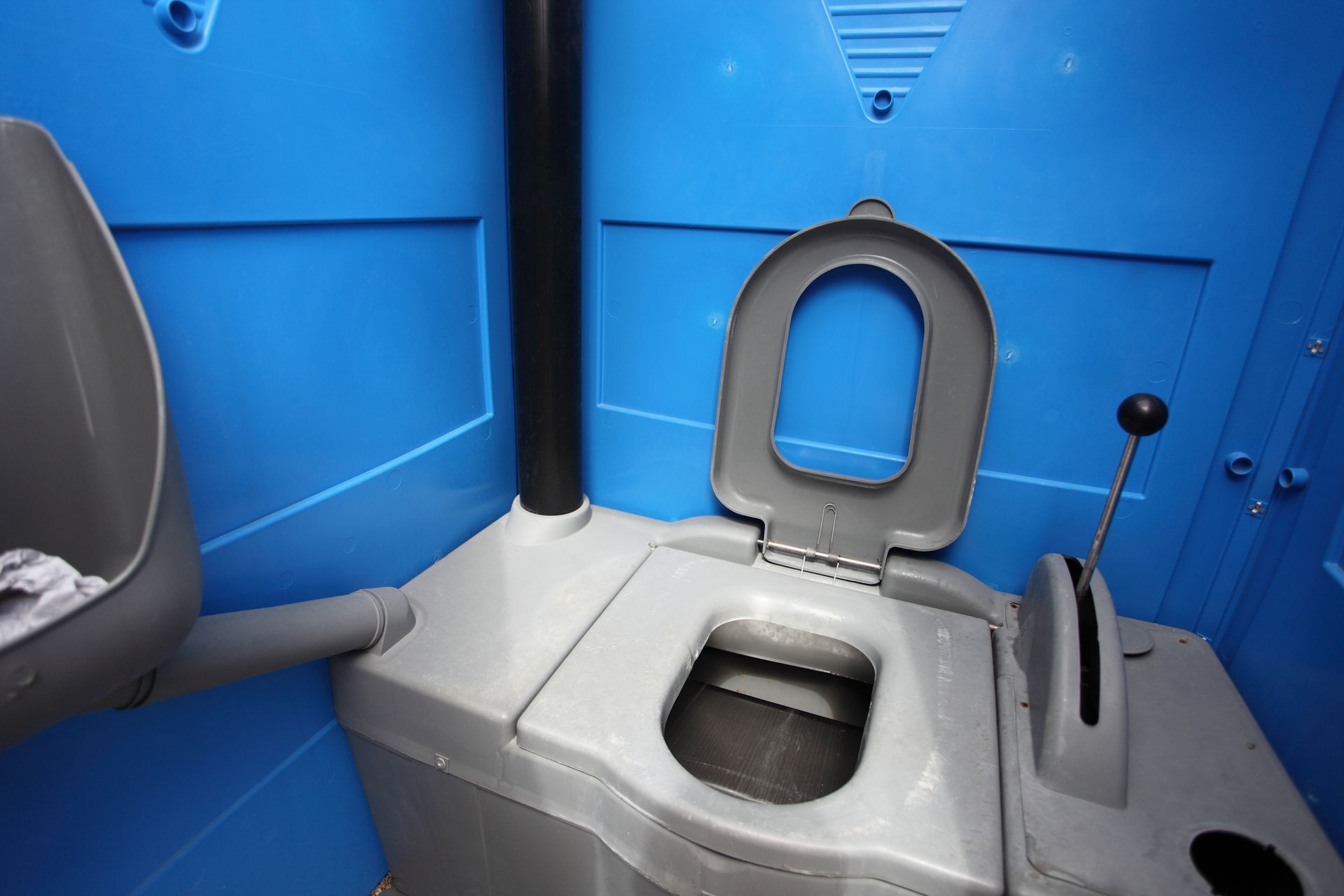 A blue and gray toilet with the lid open