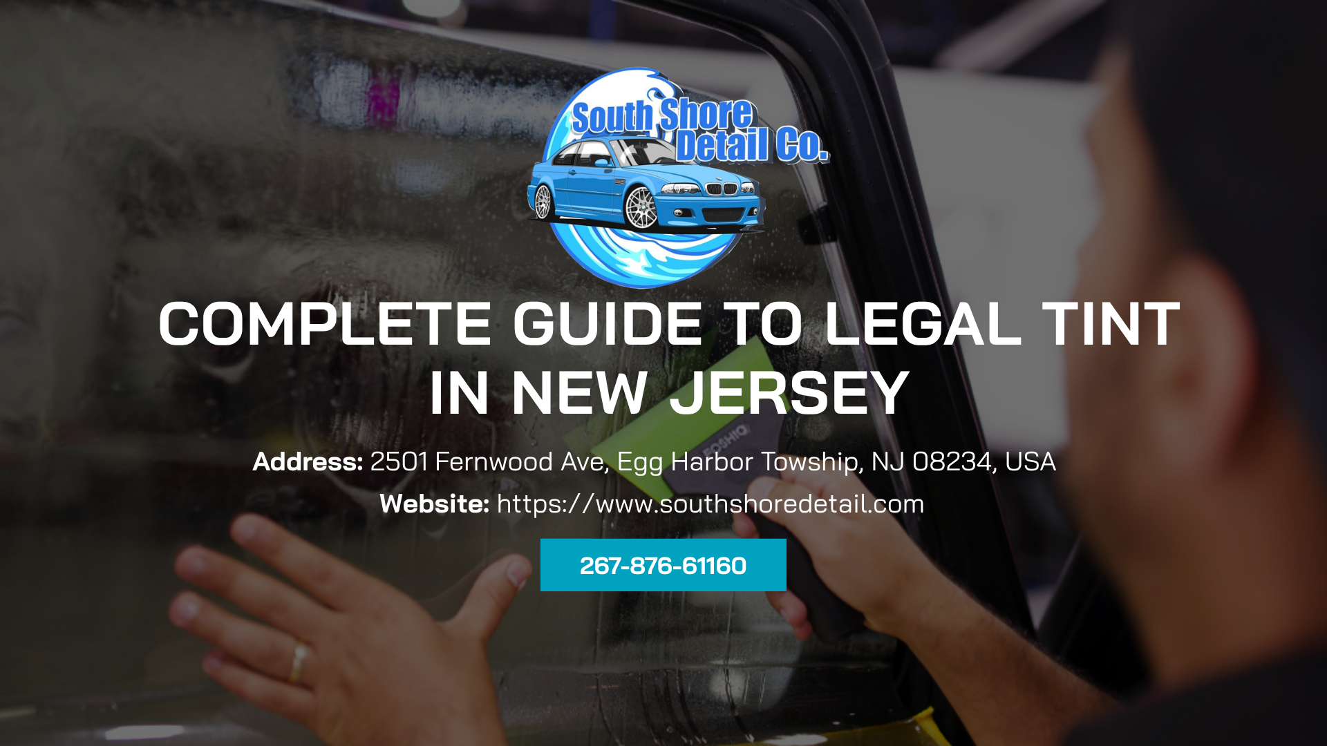 A Dodge Challenger and Ford Raptor truck parked in a well-lit garage with colorful flooring.